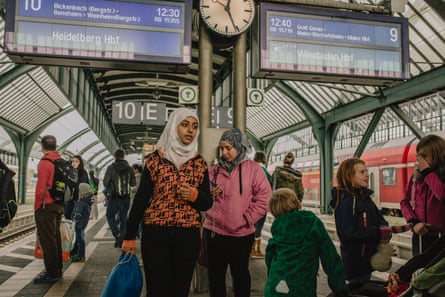 Lubna waits on a platform for a train to Stuttgart.