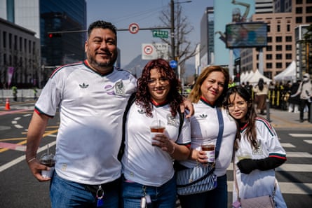 Fans pose for a portrait near the BTS concert venue in Seoul