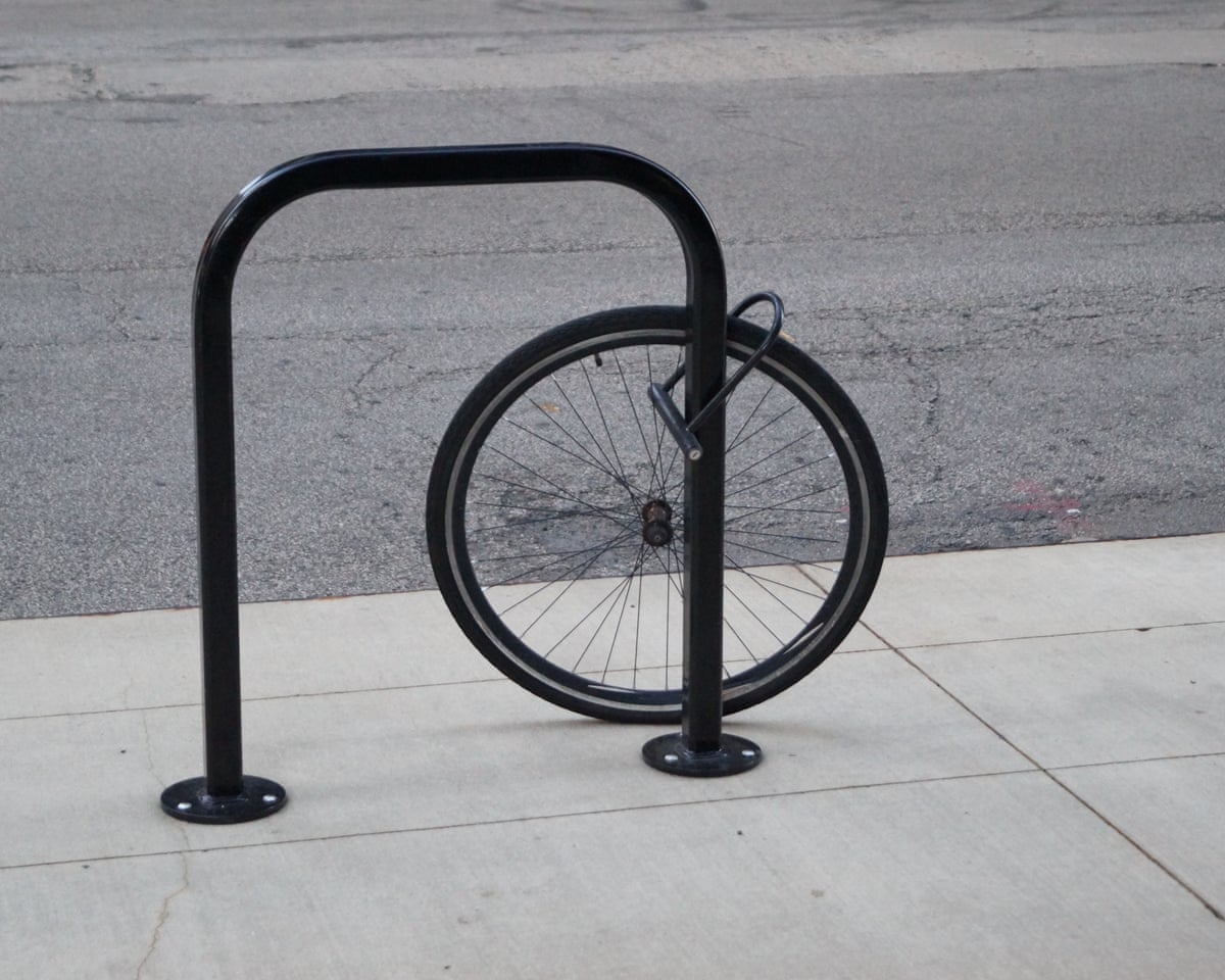 Just the front wheel remains locked to a cycle hoop after a bike has been stolen