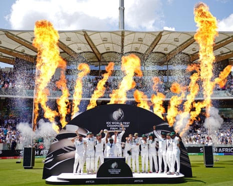 South Africa captain Temba Bavuma (centre) lifts the World Test Championship trophy alongside his celebrating teammates.