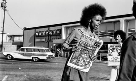 Gloria Abernethy sells the Black Panther newspaper. Tamara Lacey holds a sickle-cell anaemia poster at the Mayfair supermarket boycott in Oakland, California, 1971.