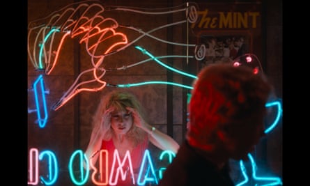 Teri Garr as Frannie stares through a neon-lit window in One From the Heart.