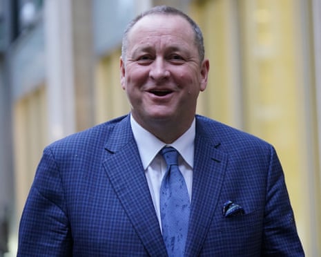 Mike Ashley, founder of Sports Direct, in a blue suit and tie.