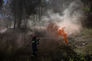 A volunteer firefighter takes part in a drill
