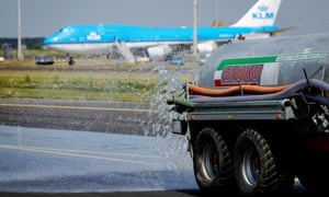 Water is sprayed on a taxiway at Schiphol airport in Amsterdam, the Netherlands