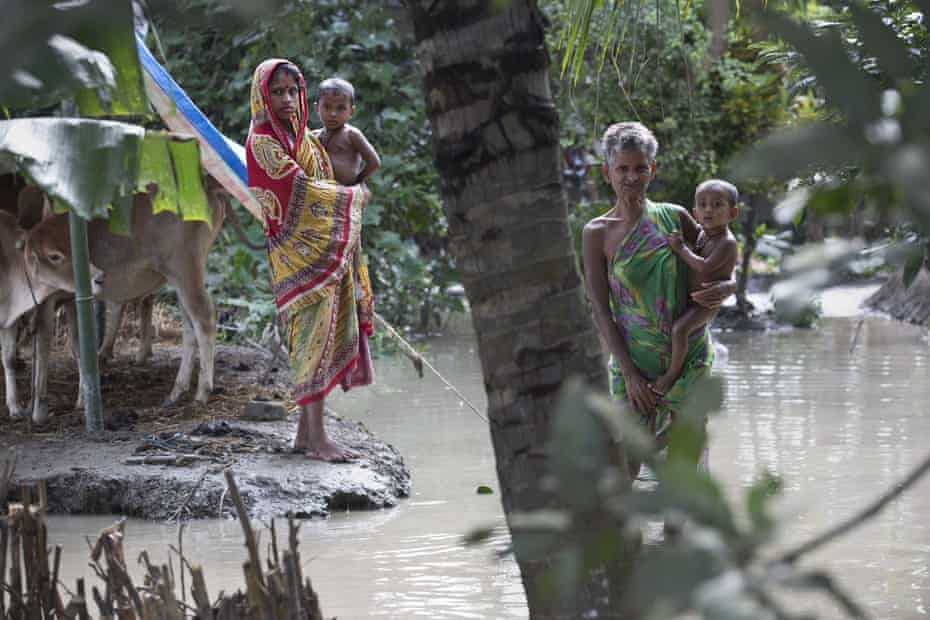 Stranded flood victims wait for help in Pokoria village, north eastern Assam state, India