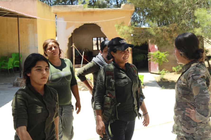 Zeynab Serekaniye prepares to go on duty at Tal Tamr