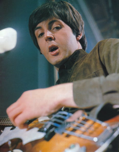 Paul McCartney, seen from the angle of his violin-shaped bass guitar