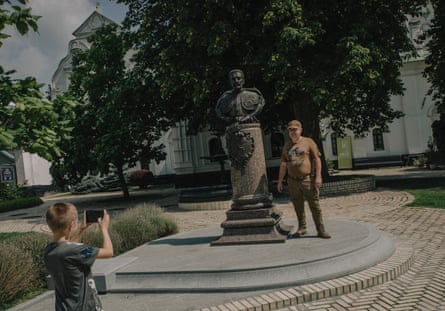 A bust of Ivan Mazepa in Kyiv’s Pechesk Lavra. Mazepa monastery with a tourist having his photo taken next to it
