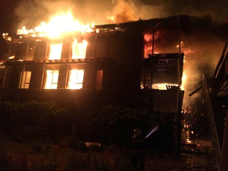 In this image released by Ukraine’s state emergency services a firefighter is seen working at the site of a recreation hotel hit by a Russian missile strike in the village of Kobleve, Mykolaiv.
