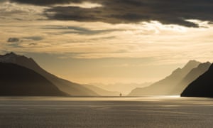 Sunrise in Beagle Channel with Tierra del Fuego Mountains in the background.