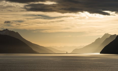 Sunrise in Beagle Channel with Tierra del Fuego Mountains in the background.