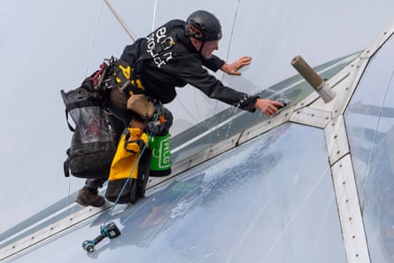 Robson dangles on the side of a biome