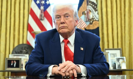 Man crosses his hands sitting at table