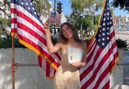 Ksenia Khavana posing with her US naturalisation papers.