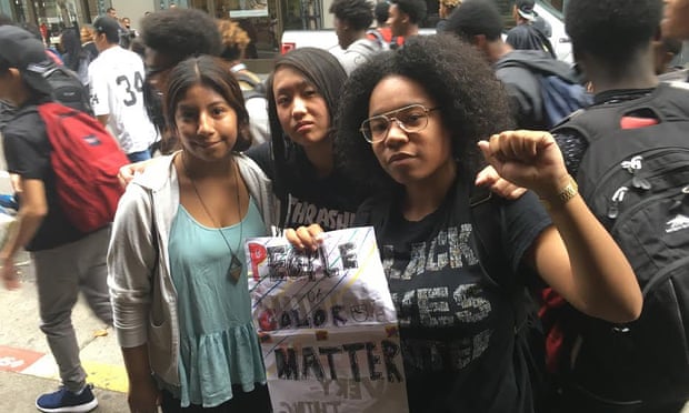 Brittany Robinson (right) and her friends protest in San Francisco.