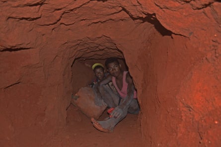 Tavita (left), 14, and Roland, 17, hunting for tourmaline around 15-20 metres below ground.