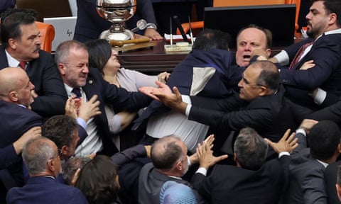 The fight broke out after former footballer and AKP MP Alpay Ozalan attacked opposition MP Ahmet Sik eiqrkixdiqdzinv