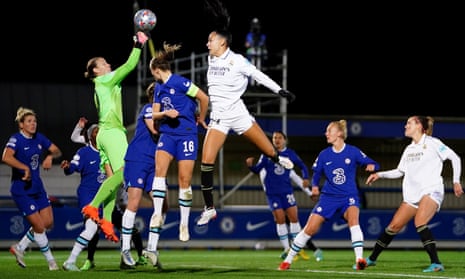 Chelsea goalkeeper Ann-Katrin Berger punches the ball out from a corner.