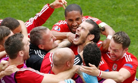 Gareth Bale is mobbed after scoring for Wales against Slovakia at Euro 2016.