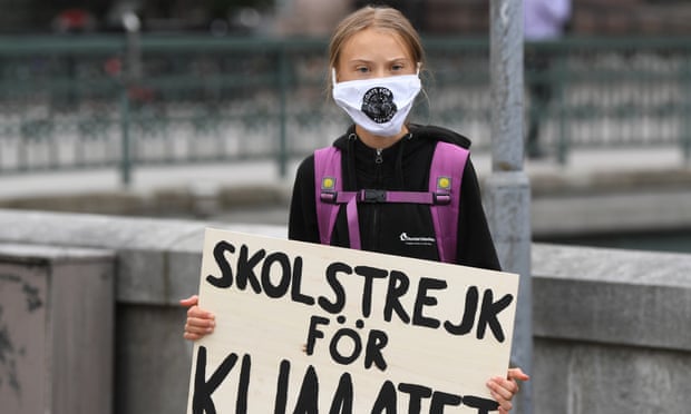 Greta Thunberg with a placard reading “School strike for Climate” in front of the Swedish parliament on Friday.