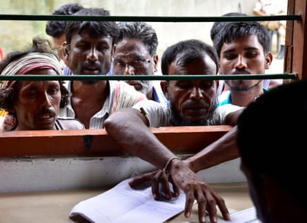 Indian villagers check their names on the final register of citizens at the NRC office in Morigaon, Assam, on 31 August 2019.