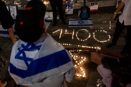 People participate in a candlelight vigil in Dizengoff Square on 5 November in Tel Aviv, Israel to remember the victims of the 7 October attacks by Hamas