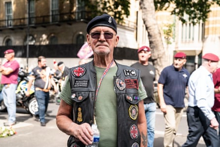 Mick Curtis on the march, posing in a beret and leather waistcoat adorned with badges