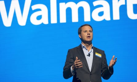 Doug McMillan against the Walmart logo.