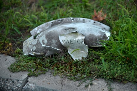 A fragment of a projectile lies on the ground after the attack