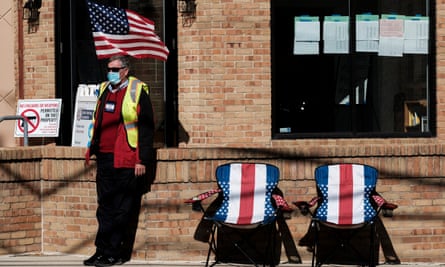 A poll worker sits outside and assists voters at a polling station in Columbus, Ohio, in November.