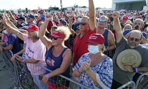 Supporters cheer for speakers at a campaign rally prior to the arrival President Donald Trump at the Orlando Sanford International Airport Monday, Oct. 12, 2020, in Sanford, Fla. (AP Photo/John Raoux)