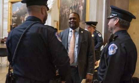 U.S. Capitol Police officer Eugene Goodman, who lured Capitol rioters away from senators on January 6, talks with colleagues after a Congressional Gold Medal ceremony on December 6 honoring law enforcement officers who defended the U.S. Capitol on Jan. 6, 2021.