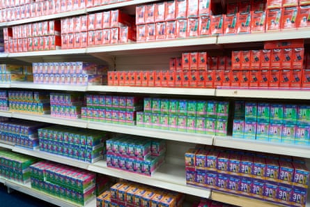Rows of variously coloured vape products on shelves