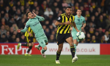 Troy Deeney (right) looks straight ahead after his elbow on Lucas Torreira.