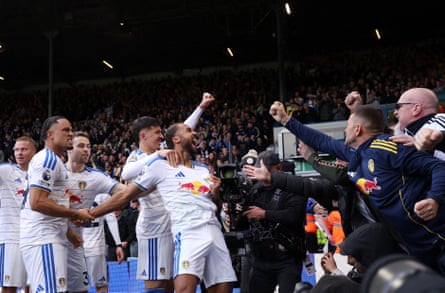 Leeds’ Dominic Calvert-Lewin is mobbed by his teammates after scoring the equaliser