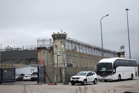 Vehicles of the International Committee of the Red Cross (ICRC) arrive to the West Bank military prison of Ofer to receive Palestinian prisoners and detainees on Saturday.