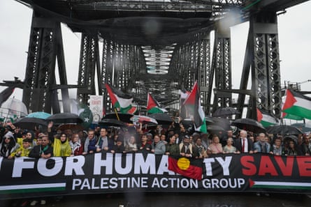 Thousands of pro-Palestine protesters walk across the Sydney Harbour Bridge in August.