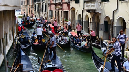 Gondolas full of tourists in a “traffic jam”.