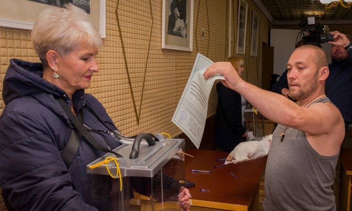 A man casts his ballot at a polling station in Luhansk, Ukraine. The referendums have been widely condemned in Kyiv and the west as illegitimate.
