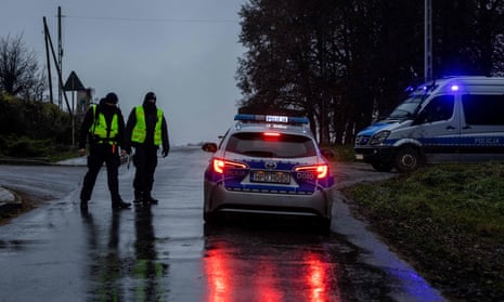 Police and secret services in Przewodów after a missile strike killed two people in the village