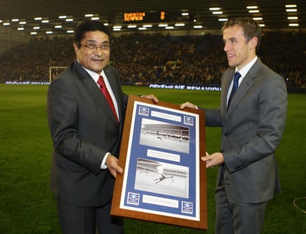 Former Benfica player Eusebio (left) recieves a gift from Everton’s Phil Neville, prior to kick off of the Europa League group game between Everton and Benfica in November 2009.