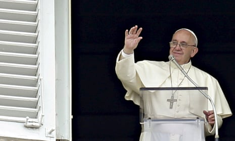 Pope Francis waves the faithful during his Sunday Angelus prayer in Saint Peter’s Square at the Vatican.