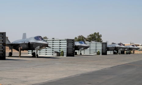 US air force F-35 fighter jets at an undisclosed location in the Middle East. The Pentagon is considering putting armed personnel on commercial ships traveling through the Strait of Hormuz.