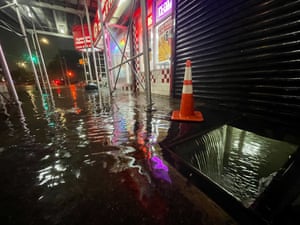 Rainfall floods the basement of a fast-food restaurant in the Bronx
