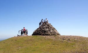 Kids sitting on top of Dunkery Beacon, Exmoor’s highest point, Somerset