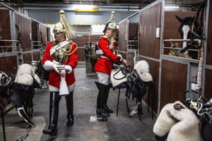 Members of the Household Cavalry in the stable area after rehearsing at London's Olympia for the International Horse Show
