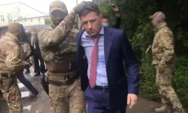 Russian officers detain the governor of the Khabarovsk region, Sergei Furgal.