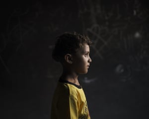 Qasim al-Masri, six, at his house in Beit Hanoun, northern Gaza Strip. An explosion on 10 May in a field near their home killed his best friend and cousin, Marwan, seven. They’d been inseparable, his father says. Marwan’s only brother, Ibrahim, 11, was also killed. The attack completely changed Qasim, his father says. The young boy talks to himself. At night, he’s paralysed by fear and does not get out of bed to use the bathroom