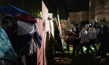 Counter-protesters confront a pro-Palestinian encampment at UCLA